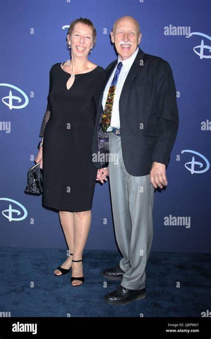 Diane Pol with husband Dr. Jan Pol sitting in a sofa