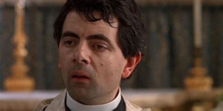 Rowan Atkinson as Father Gerald in Four weddings and a Funeral Johnny