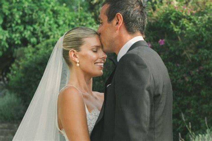 Tash Oakley stuns in lace gown at wedding to Theo Chambers